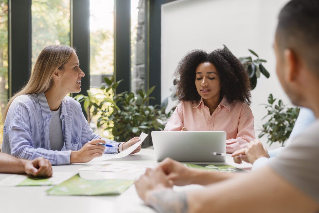 people working tech brand together